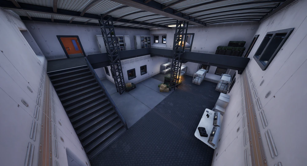 Looking down into a Lakeside Lab laboratory with a staircase, metal gantry and bunk beds