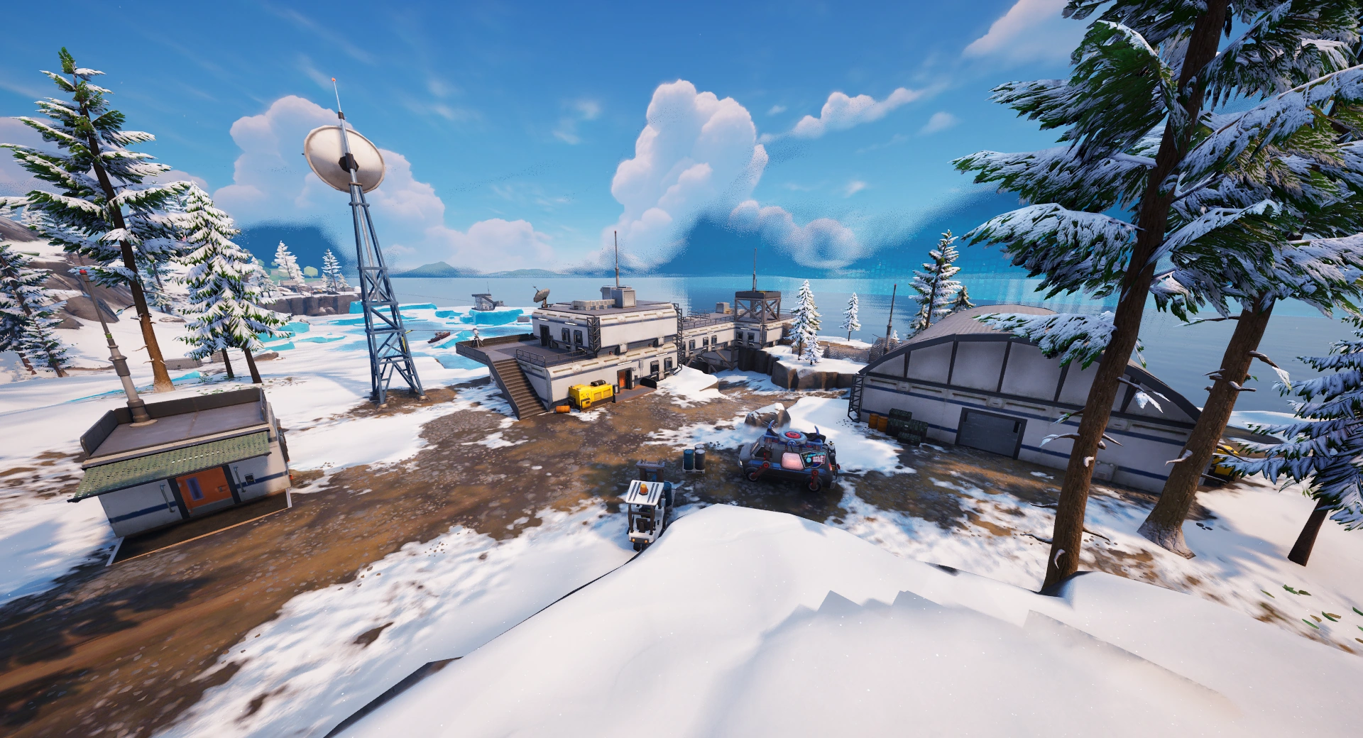 The Lakeside Lab, a group of white prefab buildings and hangars on a snowy shore beside a radio mast